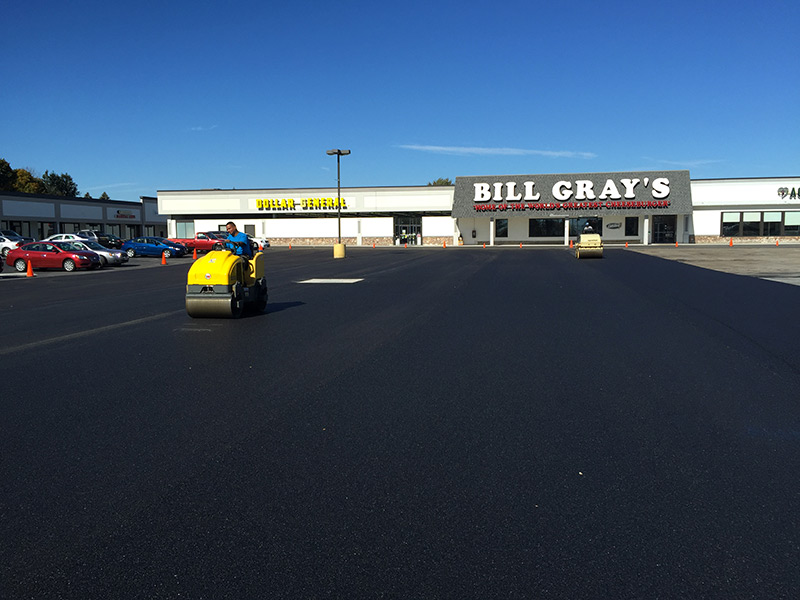 paving shopping center wit Bill Grey's building in view